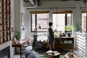 woman walking in her home business office